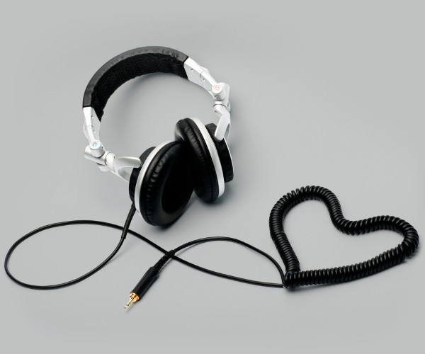 over the ear headphones with cord coiled in a heart-shape