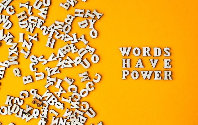 Wooden letters forming the phrase WORDS HAVE POWER