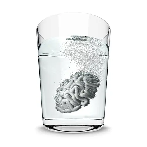 A brain that appears to be floating in a glass of water.